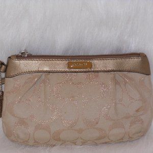 COACH GOLD METALLIC CANVAS WRISTLET WITH CROSS TOP ZIP FASTENING